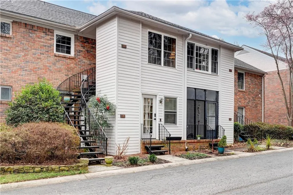 Rear entrance with view of greenspace and walking trail