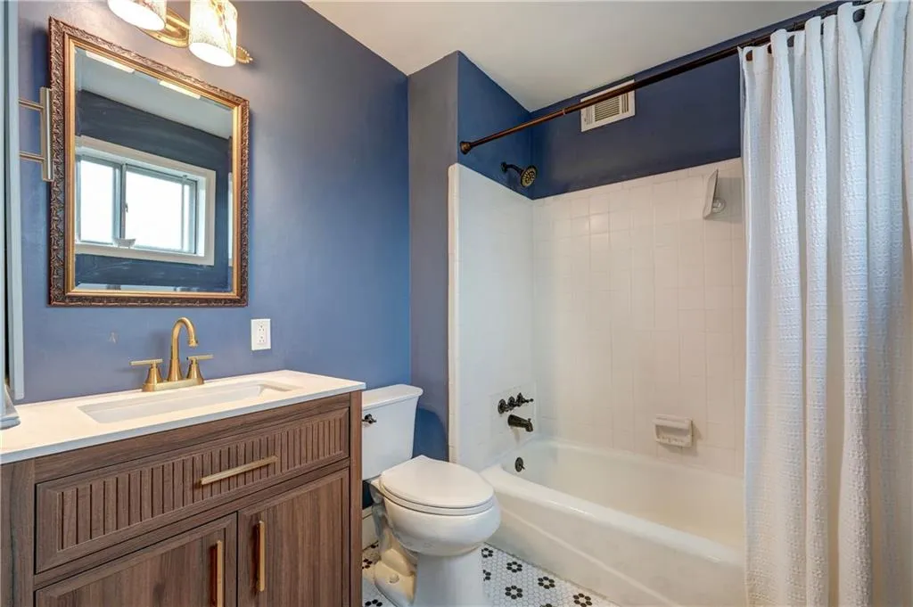 Primary bath with tile tub surround and tile floor