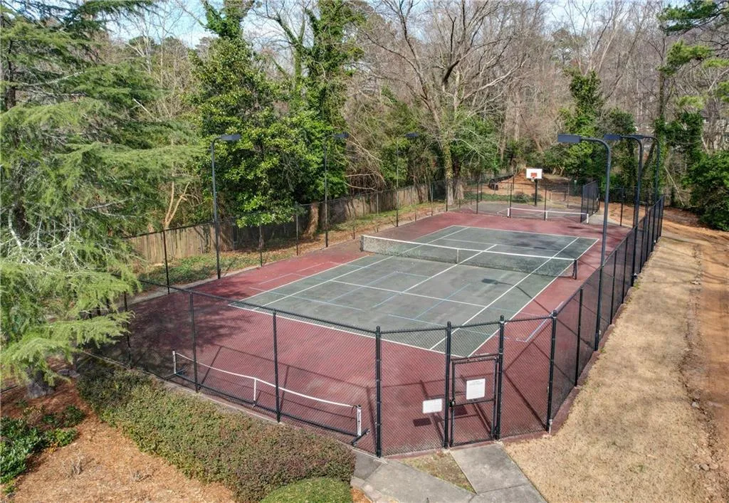Tennis court with lights and basketball court