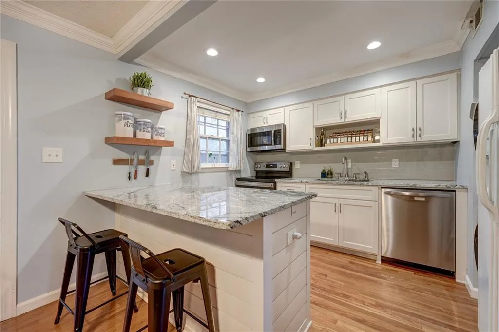 Breakfast bar with granite countertop