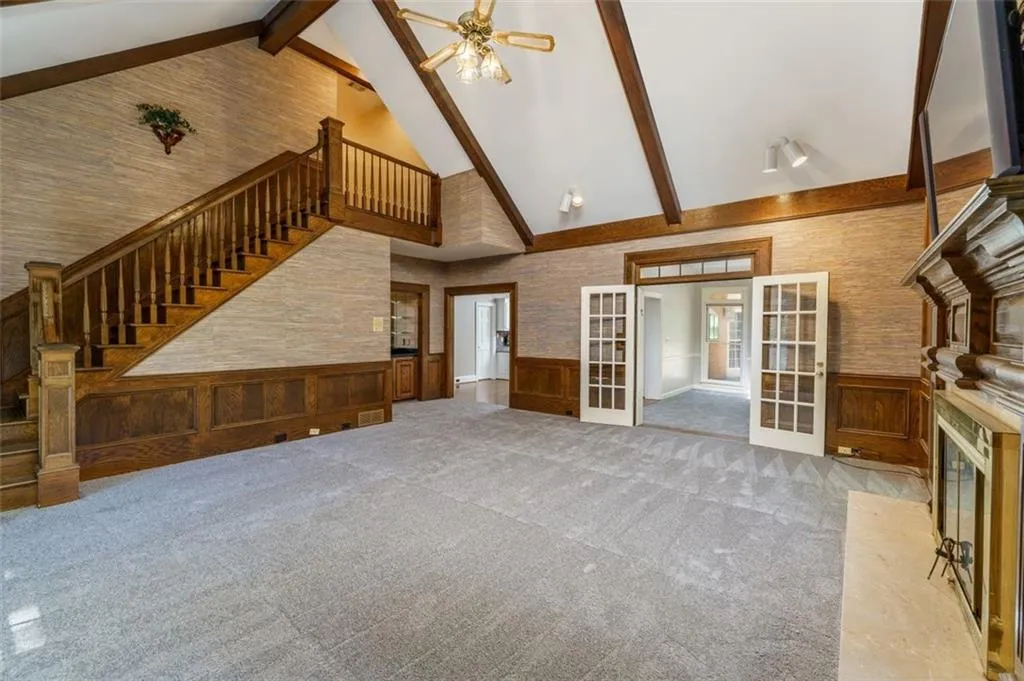 Great room open to sunroom and kitchen. Love the backstairs! Great room open to sunroom and kitchen. Love the backstairs!