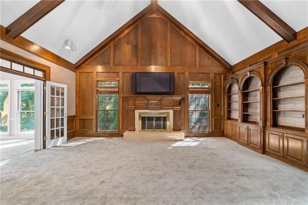 Great room offers dramatic vaulted, beamed ceiling and fireplace. All the flat screen TVs stay! Great room offers dramatic vaulted, beamed ceiling and fireplace. All the flat screen TVs stay!