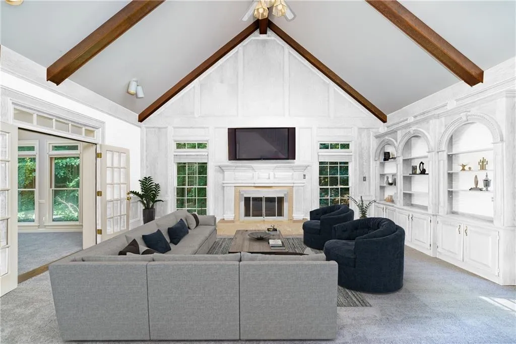 Great room offers dramatic vaulted, beamed ceiling and fireplace. All the flat screen TVs stay! (virtually staged) Great room offers dramatic vaulted, beamed ceiling and fireplace. All the flat screen TVs stay! (virtually staged)