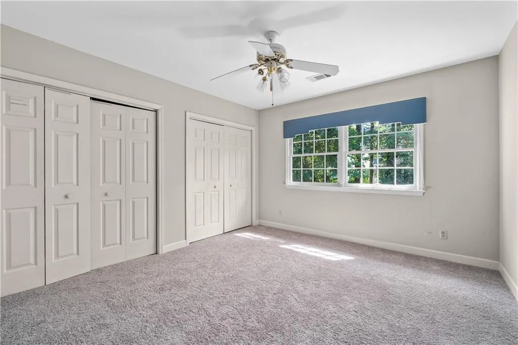 Guest bedroom with two closets and new carpet Guest bedroom with two closets and new carpet