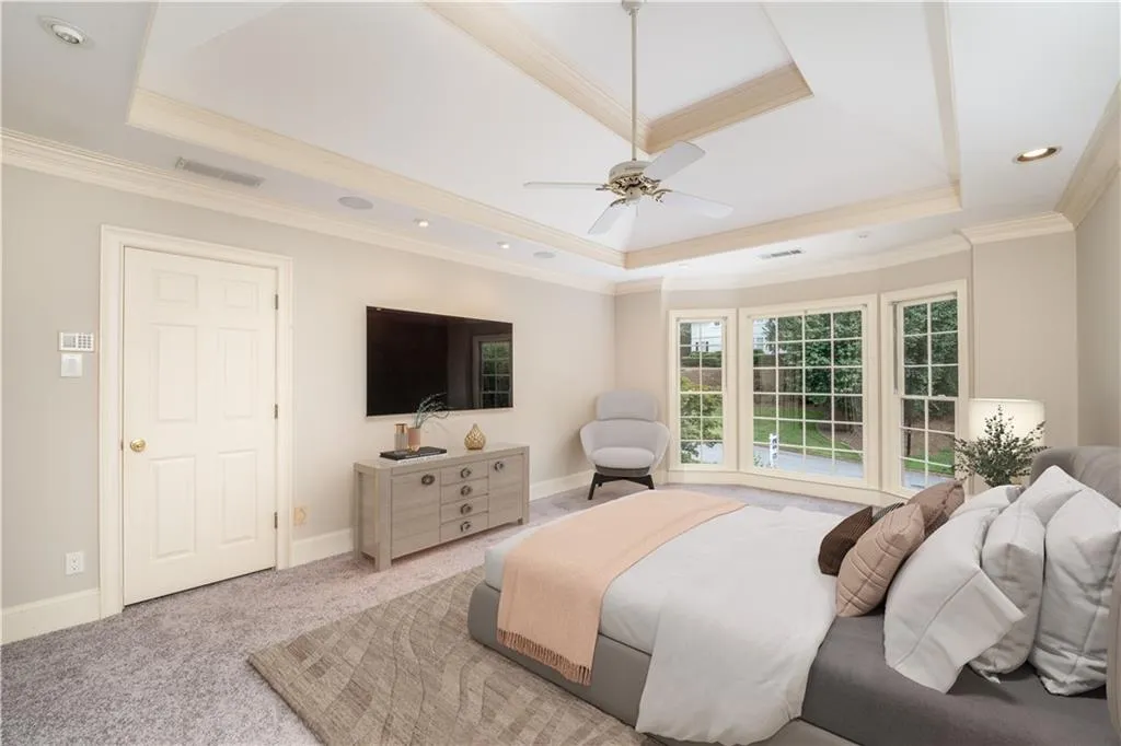 King size primary bedroom with tray ceiling and new carpet (virtually staged) King size primary bedroom with tray ceiling and new carpet (virtually staged)