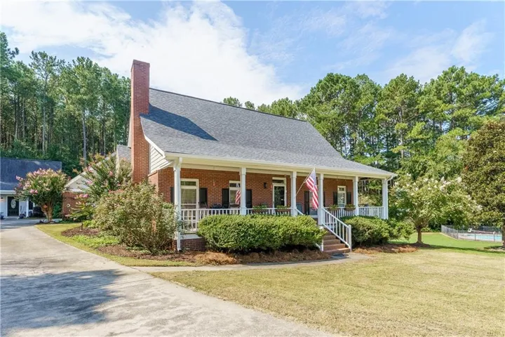 Welcome to 5454 MCCullers Lane, a classic Cape Cod design with a brick and hardi-plank exterior.