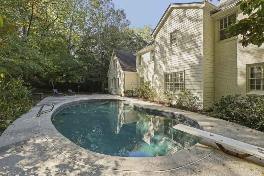 Step outside to your Private Backyard Retreat, complete with a Sparkling Pool, Diving Board, and generous patio space   perfect for entertaining or relaxing.