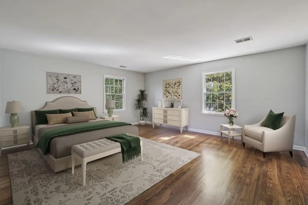 Upstairs, the Spacious Primary Suite offers room for a sitting area and includes Two Walk-In Closets and an Ensuite Bathroom with Double Vanity, Soaking Tub, and Separate Shower.