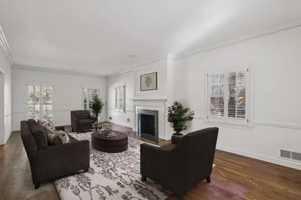 Formal Living Room centers around a Decorative Marble Fireplace