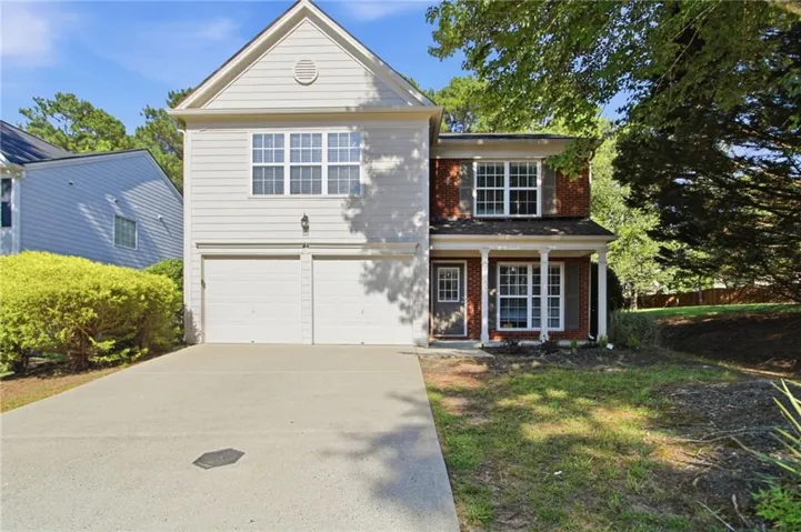 Traditional two-story exterior with a two-car garage