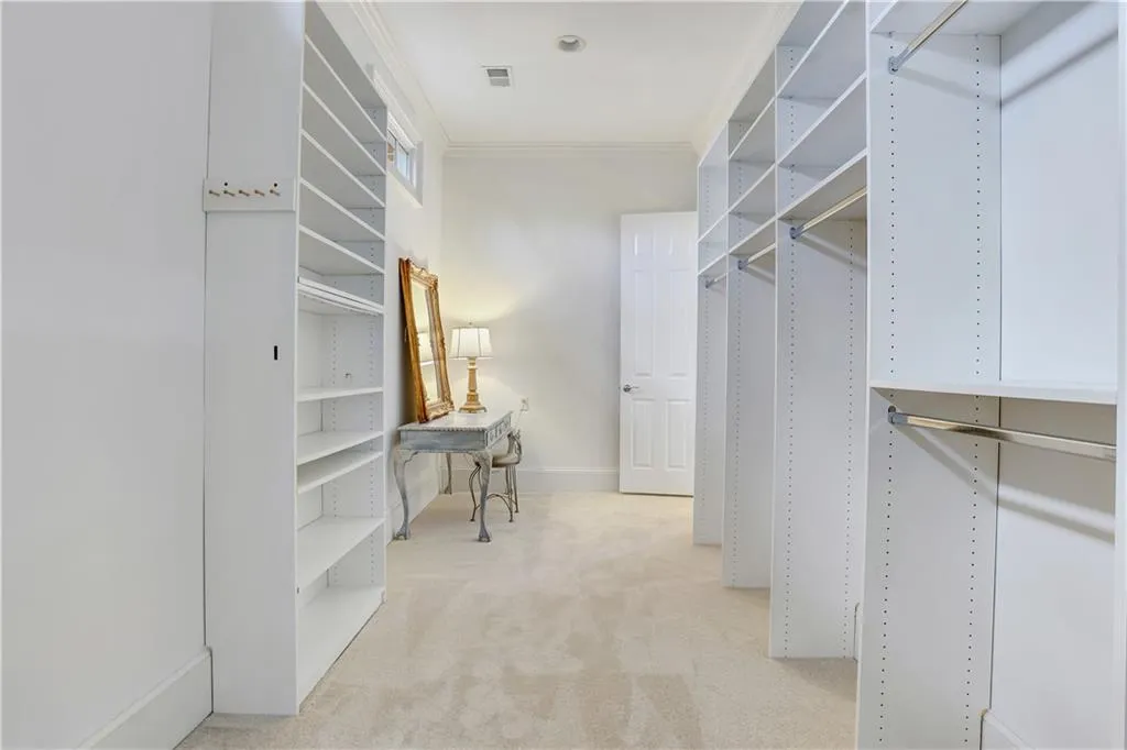 One of two primary suite walk in closets