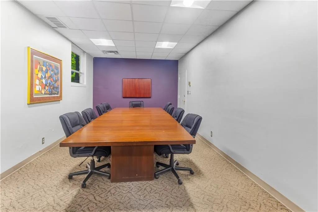 Office space featuring a paneled ceiling
