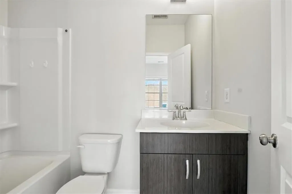 Bathroom featuring vanity and shower / washtub combination Bathroom featuring vanity and shower / washtub combination