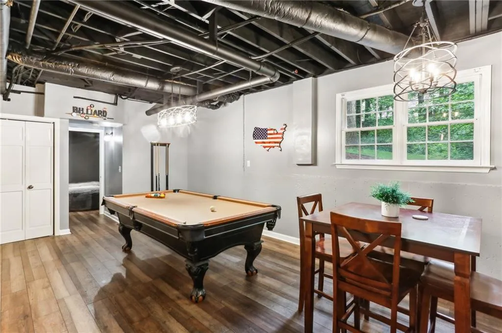 Playroom with billiards and hardwood / wood-style floors