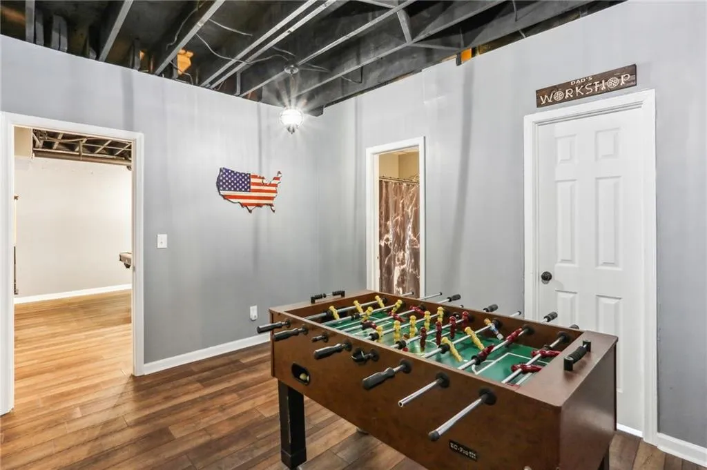 Game room featuring hardwood / wood-style floors
