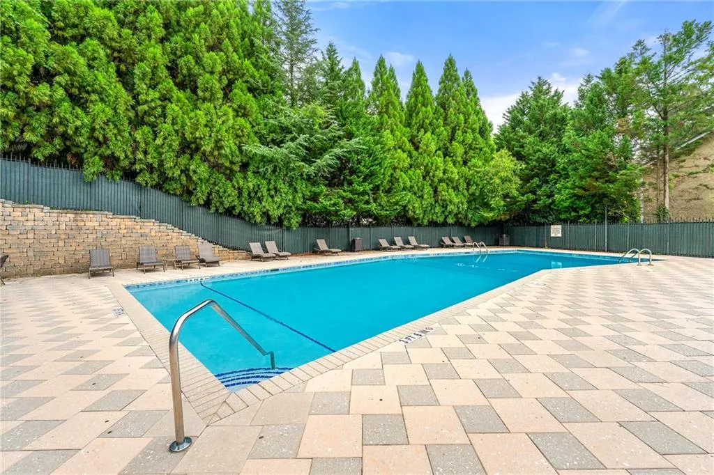 Community pool featuring a patio