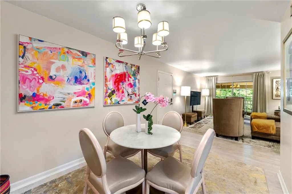 Dining space featuring a chandelier and wood finished floors