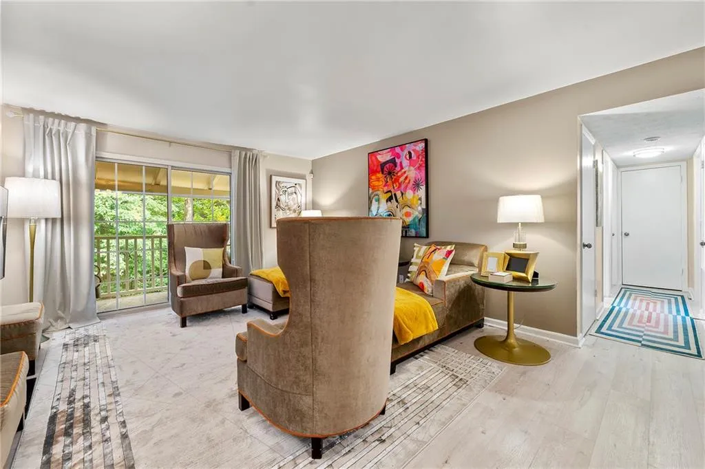 Living area featuring baseboards and wood finished floors