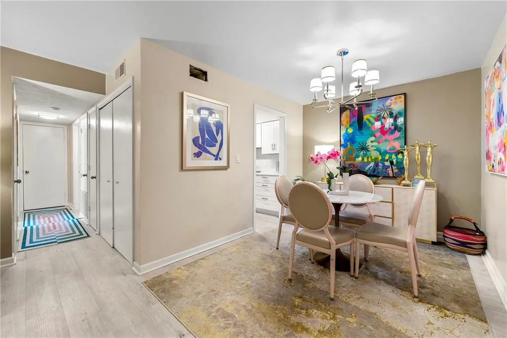 Dining area featuring a chandelier and light wood-style floors