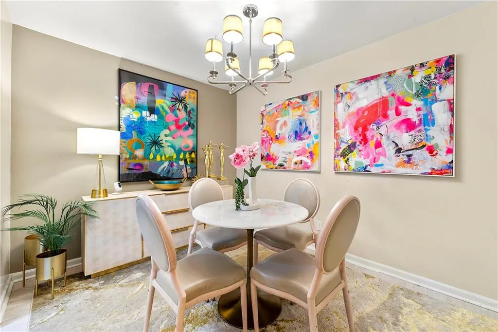 Dining space with a chandelier and baseboards