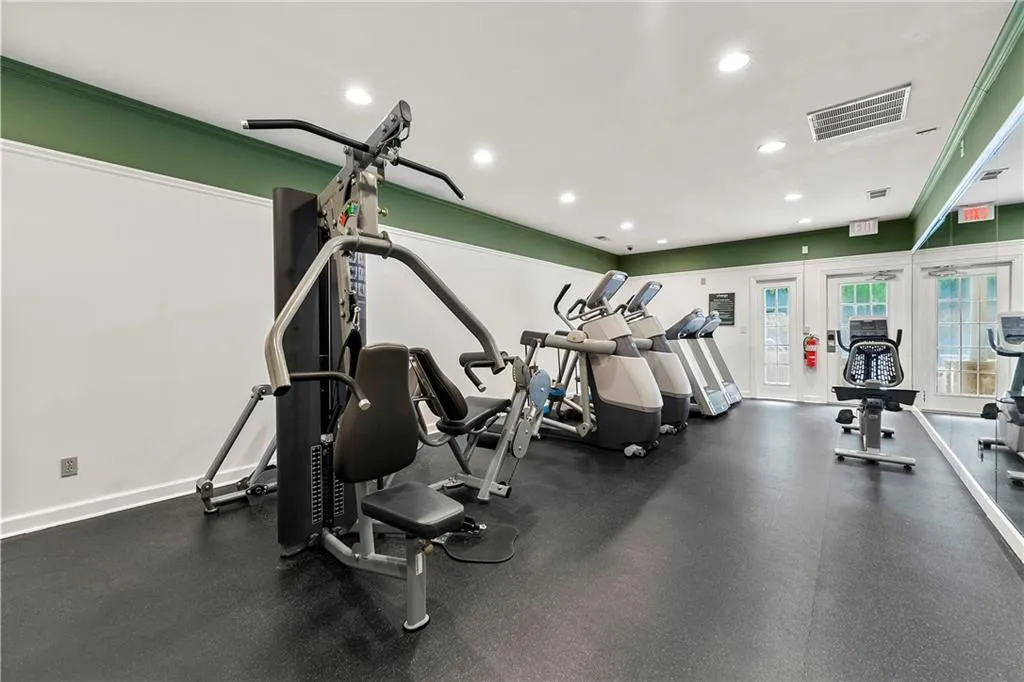 Exercise room featuring recessed lighting and baseboards