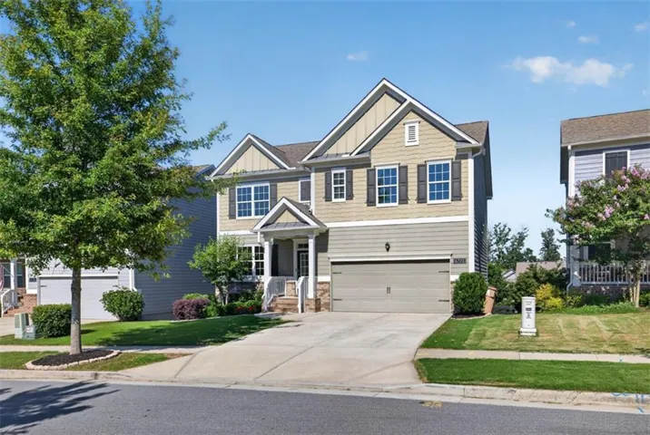 Contemporary two-story home featuring a combination of horizontal siding and shake accents