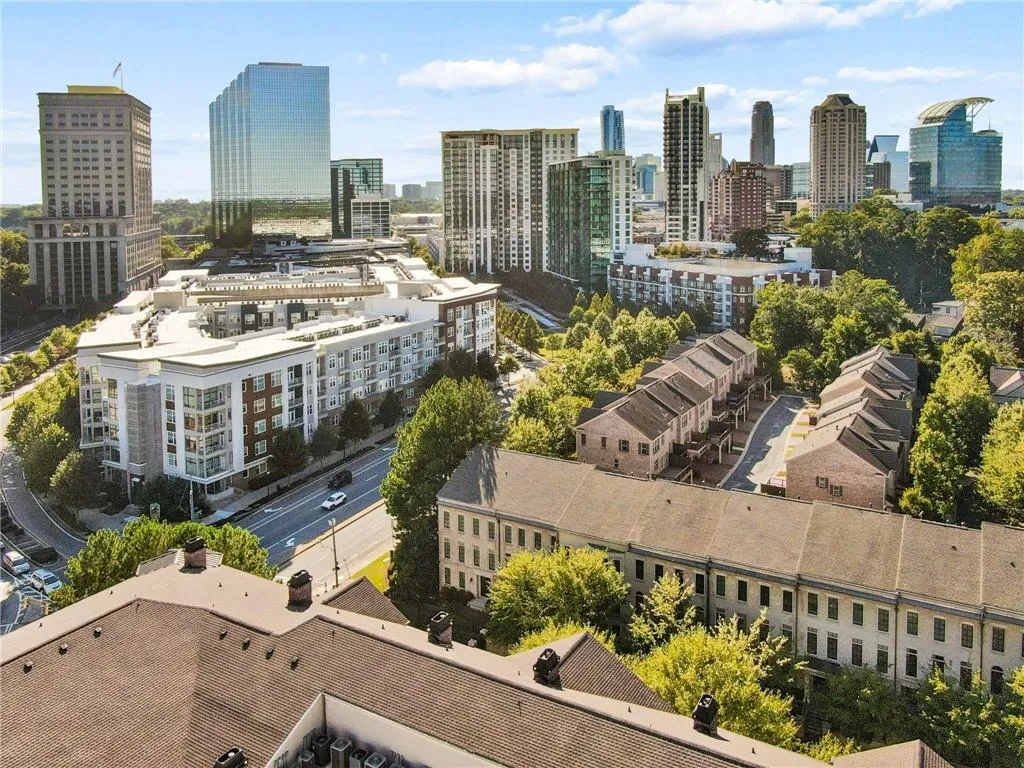 Urban landscape featuring a mix of modern high-rises and residential buildings