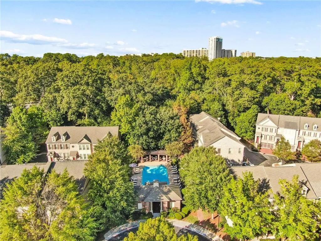 Community pool with surrounding patio