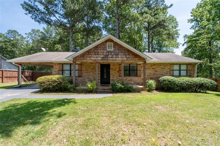 Brick exterior with wood shingle gable accent