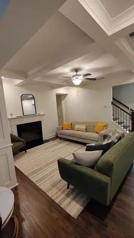 Living room with fireplace and coffered ceilings