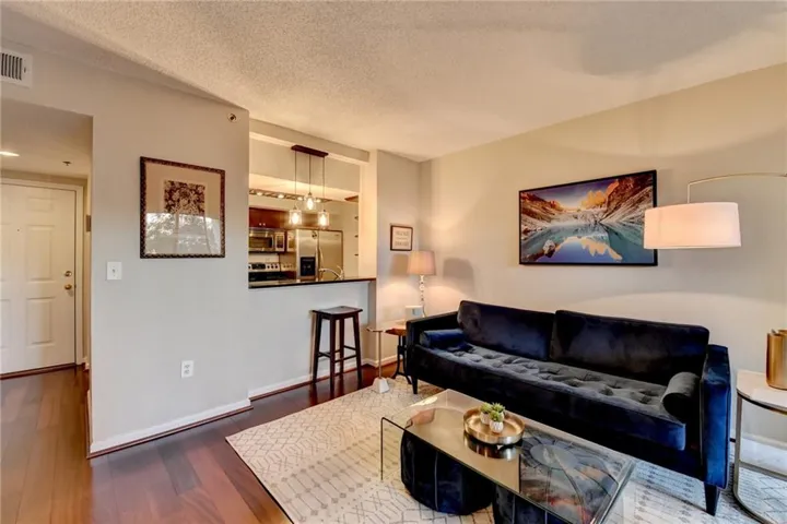 Open-concept living space featuring wood-finish flooring