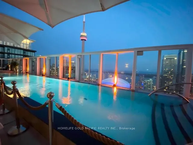 Rooftop Outdoor Pool with CN Tower and Lake View