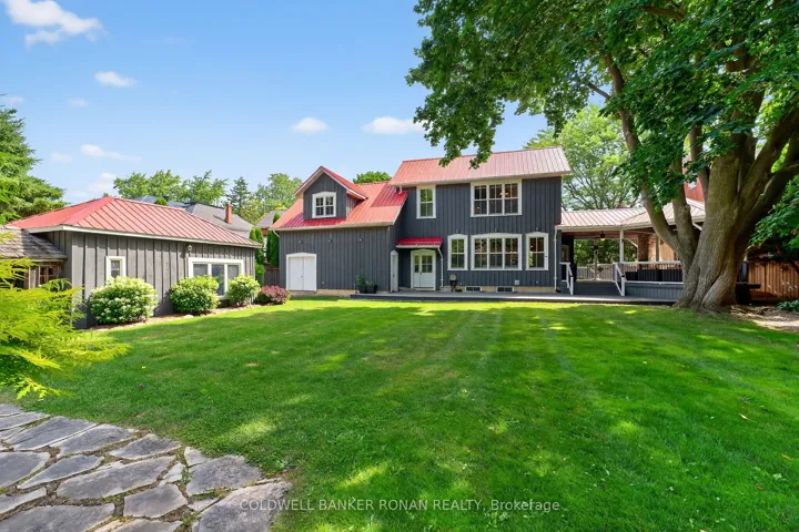 View of back of home and yard