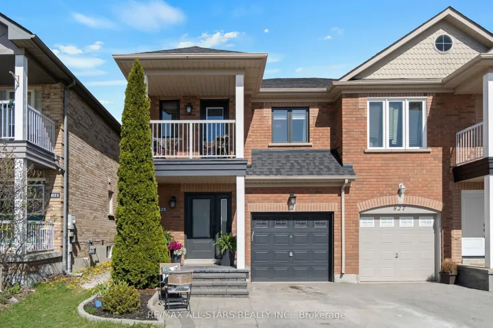 Professionally landscaped front yard w covered ent