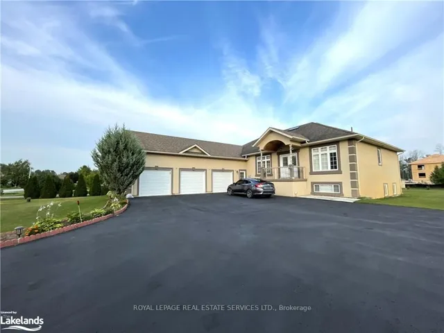 View of front of property with a front lawn