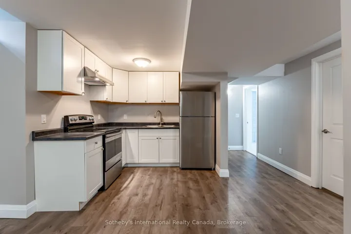 Basement kitchen with stainless steel appliances