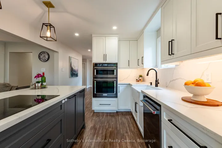 Chef's kitchen with built-in appliances.