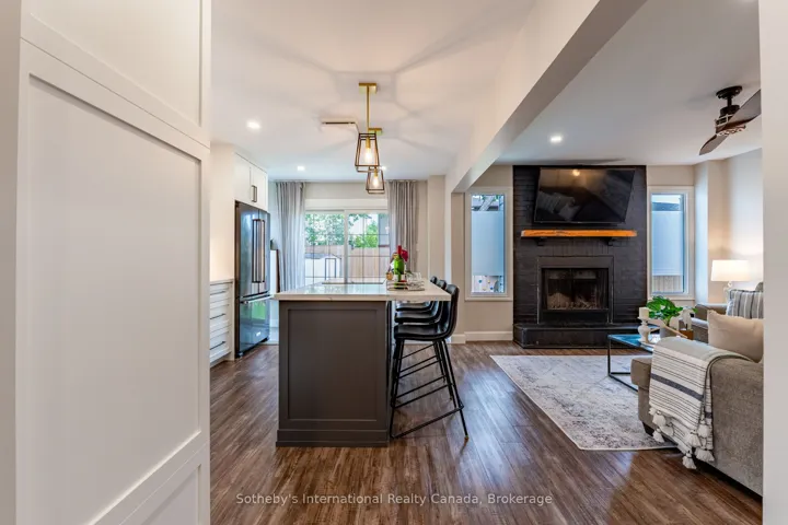 Open-concept living area with wood fireplace.