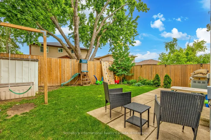 Fully fenced yard with patio.