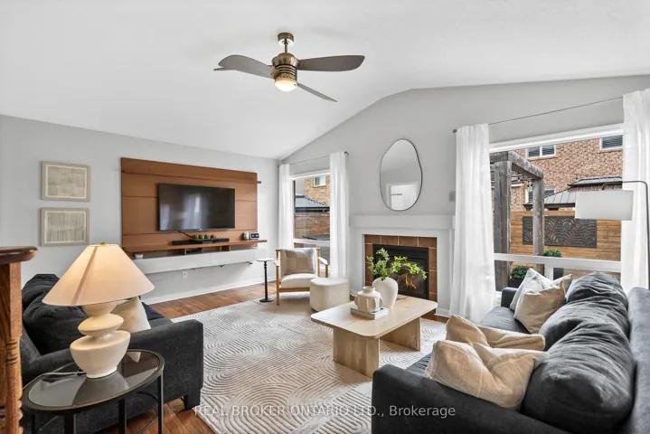 Family room with fireplace and vaulted ceiling.