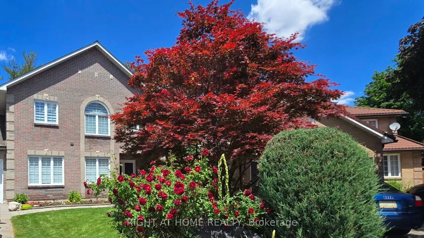 Custom Home Framed by Front Garden and Trees