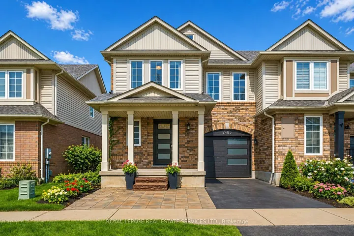 Welcome to this Rarely Offered End-Unit Townhome!
