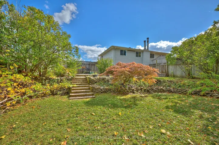 Backyard and view of the house and stone patio