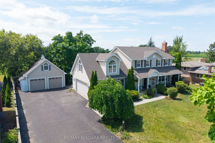 Custom built in 2003, w/two double car garages