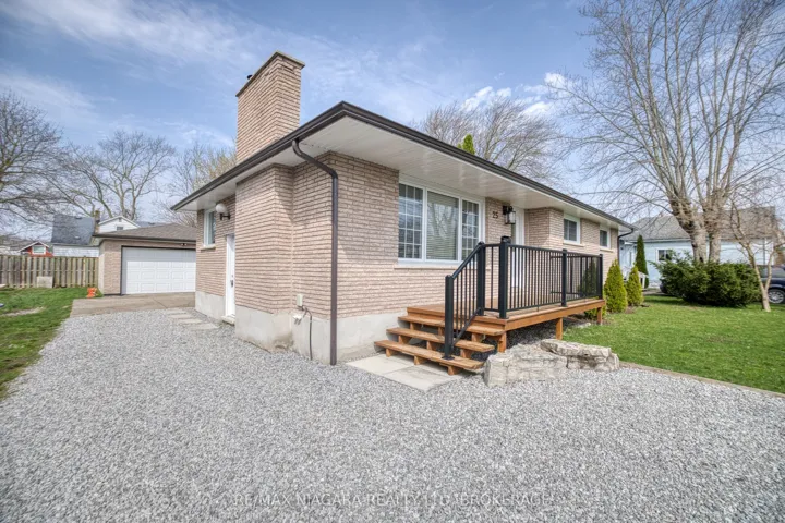 Front of house, driveway leading to 2-car garage