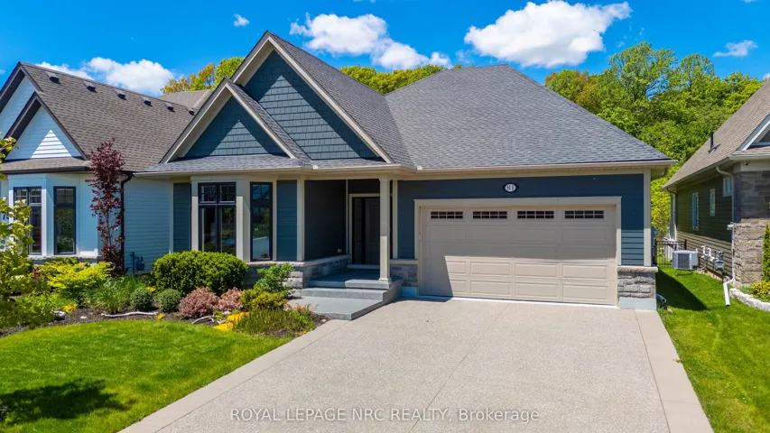 Welcome! Notice exposed aggregate driveway. Lovely