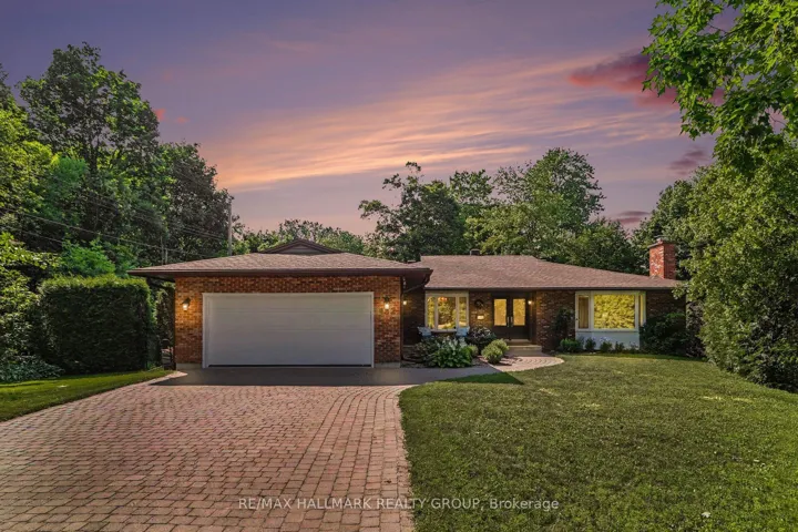 Brick bungalow, interlock drive, double garage.