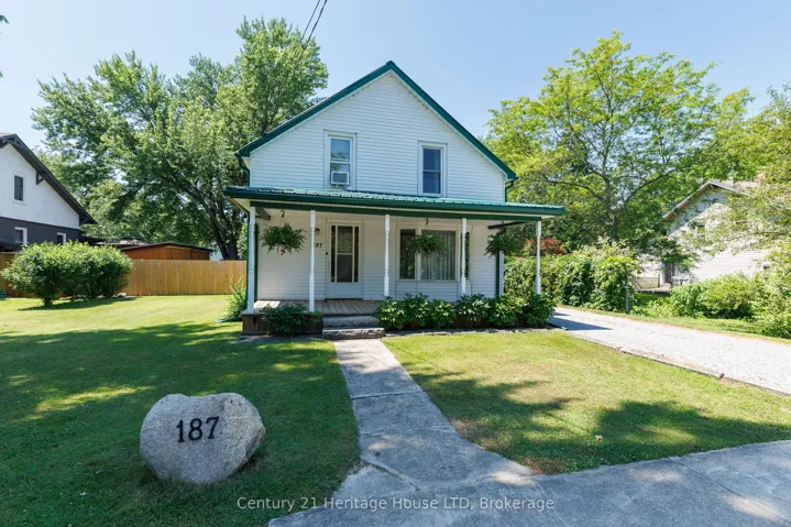 Front Exterior - porch, fully fenced & stone drive