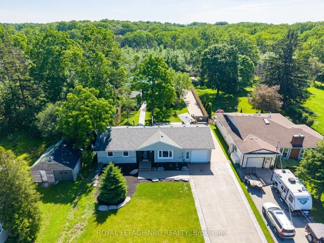 Prepare to be wowed by this half-acre paradise!