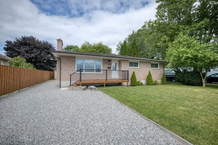 Front of house, driveway leading to 2-car garage